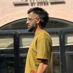 The mullet is back and more stylish than ever. This modern take features a faded temple and a textured top, keeping the business in the front and party in the back.