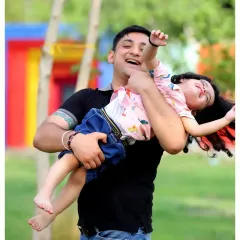 A father and daughter sharing a moment of pure happiness. Our outdoor lifestyle sessions are all about capturing the fun and energy of your family.