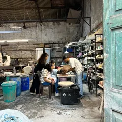 The joy of making your own Ganesha. A family works together in our studio, learning to sculpt their idol with guidance from our instructors.