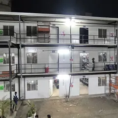 This closer view of the completed labor colony highlights the modular design, external staircases, and individual units. Our prefabricated solutions provide safe and comfortable accommodation.