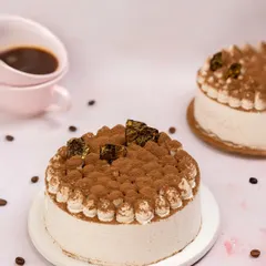 To capture the essence of this Tiramisu cake, I included coffee beans and a cup of espresso in the background. The dusting of cocoa powder on top is highlighted to showcase its texture and classic flavour profile.