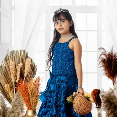 A princess in royal blue. With her tiara and elegant gown, she looks poised and beautiful in this classic fairy tale portrait session.
