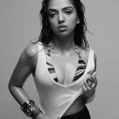 The same edgy look in a black and white treatment, highlighting the textures and the raw energy of the shot. This is a great example of versatile photoshoot styling.