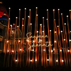 A personalized light installation with the couple's names, creating a unique and modern photo backdrop for their reception at the Lalitha Mahal Palace.