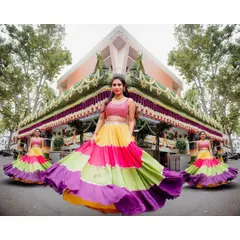 For a vibrant Mehendi ceremony, we created this fun and flowy tiered lehenga. The sequin crop top and the explosion of color in the skirt make it a perfect outfit for dancing and celebrating.