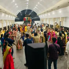 A wide-angle view of a packed hall during one of our corporate Dandiya events. Our team starts with a performance and then invites the audience to join, creating a vibrant and inclusive celebration.
