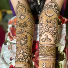 A pair of arms with non-symmetrical but complementary designs, showing creative freedom.
