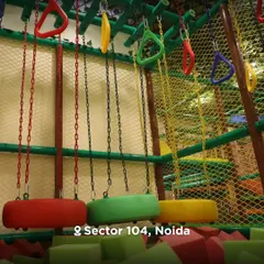 A closer look at the colorful tire swings and foam pit below. The entire ninja course is designed with safety as the top priority, with soft landings for every element.