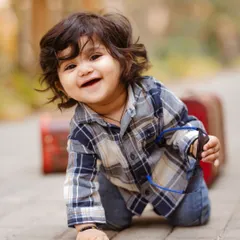 Capturing the pure joy of a baby on the move. This candid shot from a milestone session shows the genuine smiles and playful energy I strive to photograph.