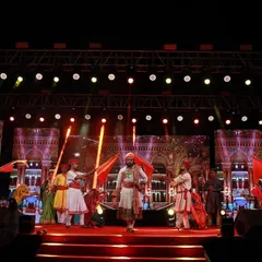 A dynamic stage moment during a cultural performance, with performers in traditional attire. My lighting and LED screen visuals are designed to complement the energy and theme of the act.