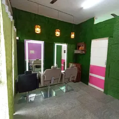 Artificial grass isn't just for outdoors. For this salon, I installed a full green wall to create a unique and calming atmosphere for their clients, showing the versatility of synthetic turf for commercial interiors.