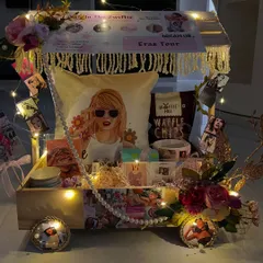 For the Swiftie in your life, this is the ultimate 'Eras Tour' in a box. I packed this custom cart with a personalized pillow, themed snacks, and tons of merch, creating a birthday gift that’s straight out of their wildest dreams.