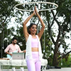Leading a hula hoop session at Zenfest with live music in the background. The hoop is a halo of happiness, and it's amazing to share that feeling.