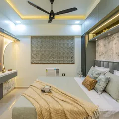 A full view of this tropical-themed bedroom. The design includes a cozy bed, a floating dressing table with a backlit mirror, and cohesive decor that makes the room feel like a peaceful getaway.