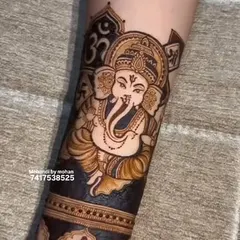 An auspicious and powerful portrait of Lord Ganesha. This design is perfect for invoking blessings during weddings, festivals, or any new venture. The "Om" symbol adds to the spiritual significance.
