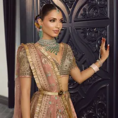 The side profile of this modern bridal look shows the seamless blend of makeup and the clean, elegant hairstyle. It's all about creating a cohesive and polished look.