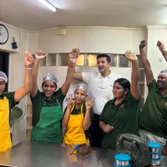 Pure joy and celebration! Our team raising their hands in excitement during our one-year anniversary. This is the energy that fuels our kitchen.