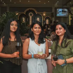 Friends gather for a memorable night at Roxie, sharing drinks and making memories.