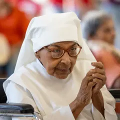 A close-up of one of the residents at The Little Sisters of the Poor, her expression showing deep appreciation for the live music. Our students' performances are designed to touch hearts and bring comfort and joy.