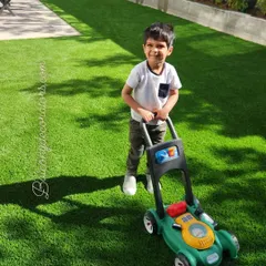 My artificial grass isn't just for looks; it's a safe and clean play area for your bachhon. It's soft, durable, and completely mess-free, so you can let them play without any jhanjhat.