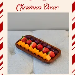 A pure sheesham wooden tray, perfect for serving fruits or a cheese platter during the holidays. Its natural wood grain adds a rustic and warm touch to your festive spread.
