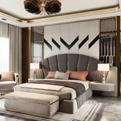We crafted this luxurious master bedroom to feel like a high-end hotel suite. The design features a grand, fan-shaped upholstered headboard, sophisticated wall paneling with metallic accents, and custom bedside tables, all working together to create an atmosphere of pure elegance.