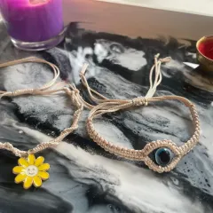 A set from my Rakhi and friendship band collection, featuring the evil eye design and a cheerful daisy charm bracelet.