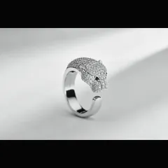 A modern and artistic panther head ring, meticulously crafted with pavé diamonds. This shot emphasizes the three-dimensional form and polished finish of the piece, perfect for showcasing unique and contemporary jewelry designs.