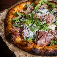 Our doors are open and the oven is hot. I hope to see you for a slice of our Prosciutto and Arugula pizza, a perfect balance of salty, peppery, and rich flavours.