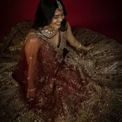 An overhead shot from the same bridal session, showcasing the intricate details of the lehenga. Our spacious setup allows for diverse angles and creative compositions.
