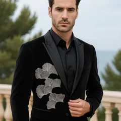 I love creating pieces that feel both classic and modern. This black velvet bandhgala jacket, with its intricate silver leaf embroidery, is designed for a man who appreciates the art of detail and wants to make a sophisticated statement at a cocktail or reception event.