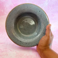 Holding one of the finished pasta bowls. You can feel the quality and sturdiness of the wheel-thrown stoneware clay.