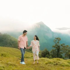 A walk through the misty hills near Sakleshpur, with the mountains creating a breathtaking backdrop. I love using natural weather conditions like fog to add a dreamy, cinematic quality to your couple portraits.