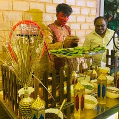 My paan station is not just about the taste, it's about the experience. My server, dressed for the occasion, skillfully prepares fresh paan for guests from a counter filled with a variety of ingredients.