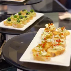 As the official culinary partner for the World Telecommunication Standardization Assembly (WTSA) 2024, we curated a global menu for international delegates, featuring items like these elegant bruschetta canapés.