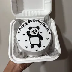An adorable panda-themed bento cake for a birthday. These mini cakes are perfect for personalized messages and cute character drawings.