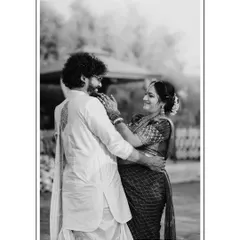 A candid, black and white photograph capturing a spontaneous, loving moment between the couple. I believe these unposed interactions tell the most beautiful stories, creating timeless memories that you will cherish forever.