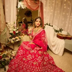The complete bridal vision in a beautifully decorated setting. The makeup was designed to be impactful both in person and on camera, with a focus on glowing skin and defined features.