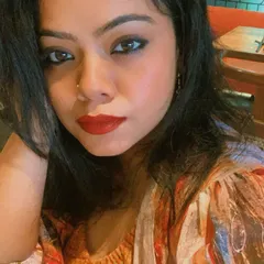 A classic makeup look with winged eyeliner and a rich red lipstick. This is a timeless choice that adds instant glamour to any outfit.