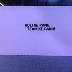 Holi ke rang, Team ke sang! We love adding fun taglines to our backdrops. This simple but effective wall was part of a larger Holi decoration, creating a great spot for team photos.