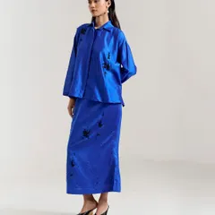 A striking royal blue co-ord set with a long skirt and matching top, featuring black floral embroidery for a touch of contrast and sophistication.