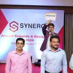 Playing a game of 'guess the word' at the Synergix annual rewards night. This game, sometimes called dumb charades, is a classic way to get teams laughing.