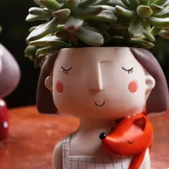 Here is a close-up of the 'fox girl' planter, one of my most popular quirky designs. The combination of the cute character and a vibrant succulent creates a truly unique and heartwarming personal gift.