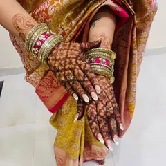 The beautiful dark stain of a full jaal (net) pattern for Karwa Chauth.
