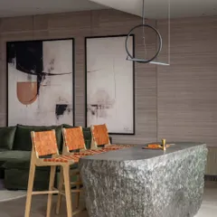 We love a little drama, and this bar counter, crafted from a single, hollowed-out block of stone, delivers just that. It’s a statement piece that anchors the home theatre area, showcasing our passion for using natural materials in bold, unexpected ways. This is custom craftsmanship at its most raw and refined.
