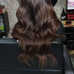 A perfect example of my mocha caramel balayage. I hand-painted these highlights to create a seamless, sun-kissed blend that looks gorgeous on Indian hair. The result is rich, dimensional color with beautiful, soft waves.