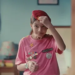 The story began here, with the character as a child dreaming of the future. I created this playful, DIY army uniform with a pink t-shirt and handmade medals to capture the innocence and ambition of her childhood aspirations.
