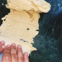 The process of making a tart starts with good dough. Here, I am working with the pate sablee, ensuring it has the perfect texture before rolling.