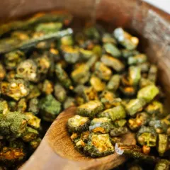 Crispy fried okra, or 'kurkuri bhindi', is a beloved Indian side dish. I serve it as a crunchy, savory element in my wedding menus, offering a taste of home-style comfort.