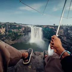 A first-person perspective shot from the edge of a cliff overlooking a waterfall, captured on my phone. It's all about finding the right angle.